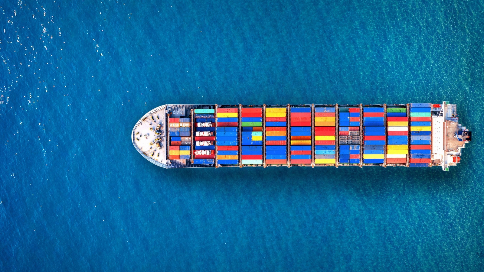 Aerial view of container cargo ship in sea.